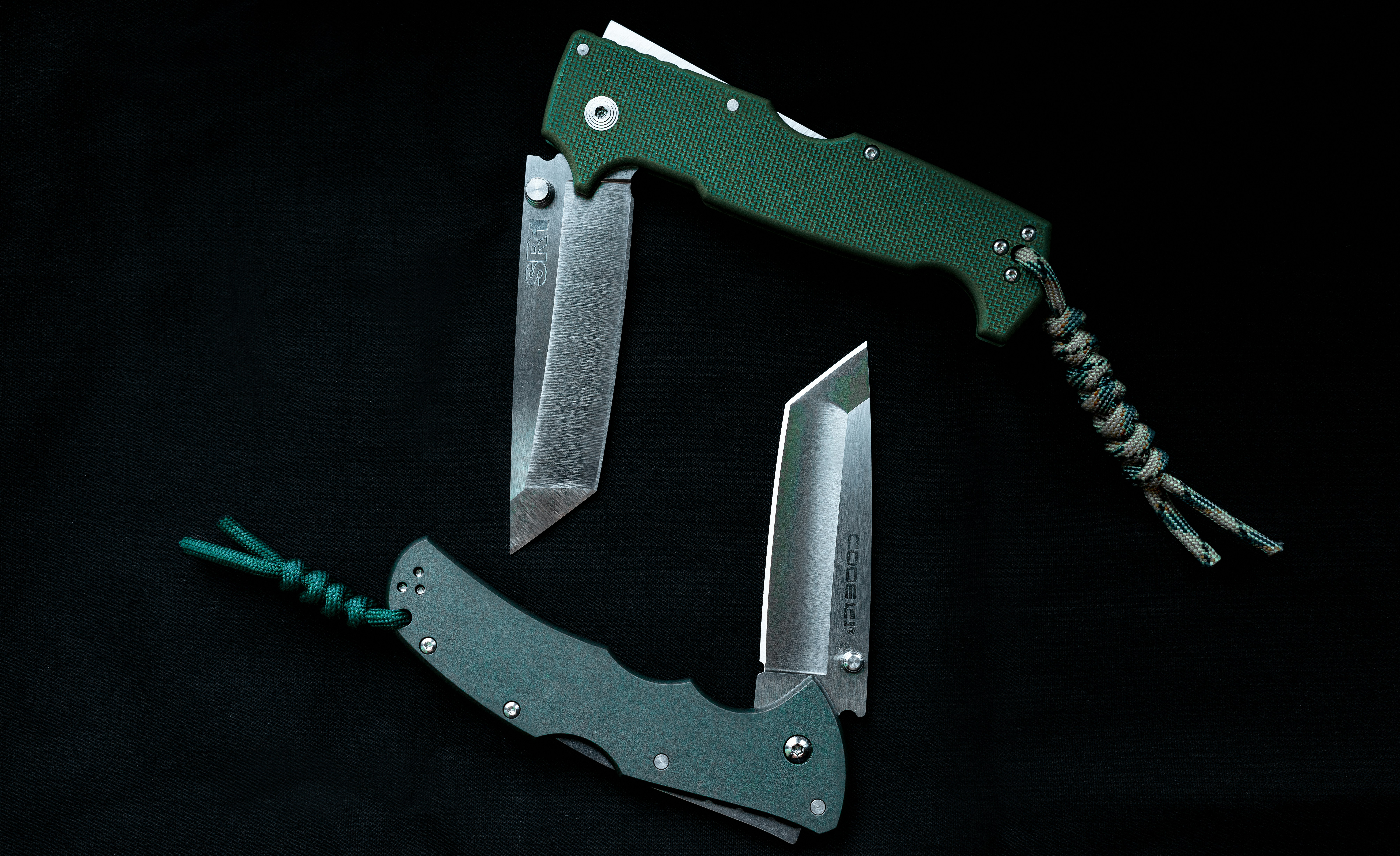 green and silver folding knife